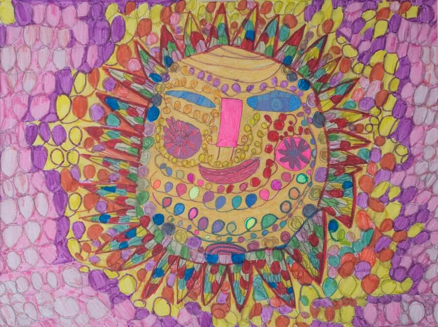 A large sun with triangle rays decorated in many colours and shapes